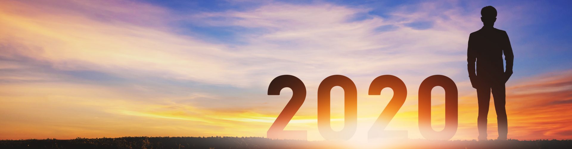 New year 2020 concept, Silhouette young success business man with sky at sunset, banner size