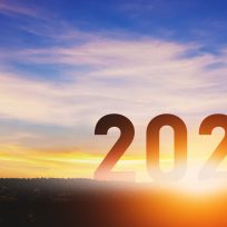 New year 2020 concept, Silhouette young success business man with sky at sunset, banner size