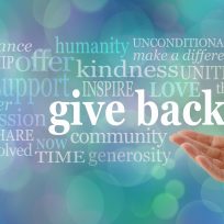 female open hand gesturing towards the words GIVE BACK surrounded by a relevant word cloud against a blue bokeh background