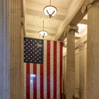 A US flag hanging at the corridor ceiling of US Capitol corridor ceiling, Interior, Washington DC.