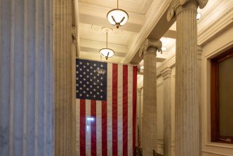 A US flag hanging at the corridor ceiling of US Capitol corridor ceiling, Interior, Washington DC.