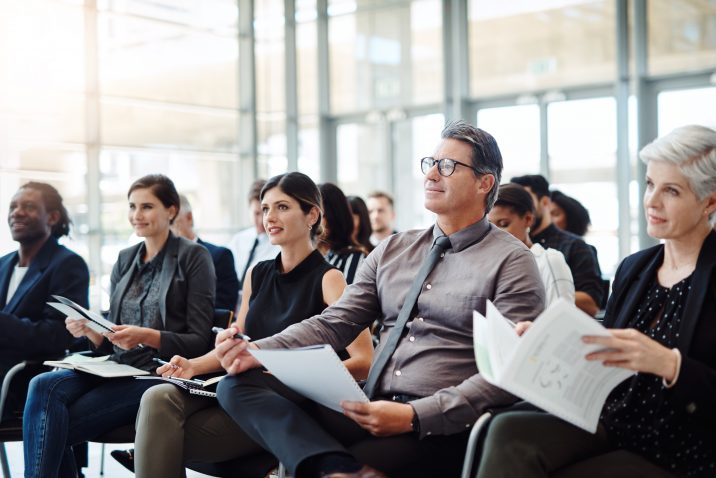 Shot of a group of businesspeople attending a conference