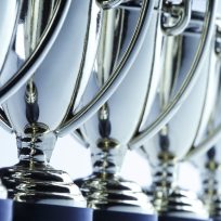 Close-up of a long row of trophies. Shot with shallow depth of field.