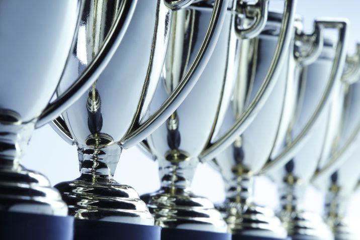 Close-up of a long row of trophies. Shot with shallow depth of field.