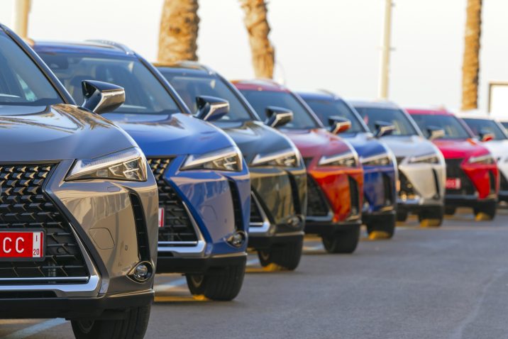 Sitges, Spain - 26th February, 2019: Lexus UX (Toyota Group) SUV vehicles in hybrid version parked on the public parking before the drives. The UX model is the smallest crossover in the Lexus offer. Focus is on the first car on the left.