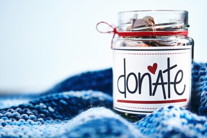 Donation money jar filled with coins