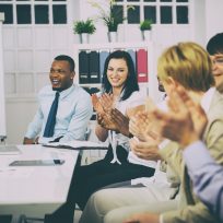 Business people clapping hands