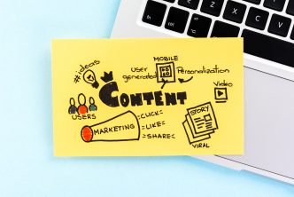 Internet content marketing sketch on blue background over notebook.