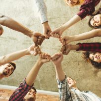 Group of people making fist bump. People solidaruty concept