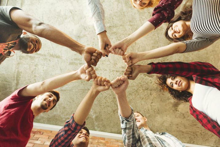 Group of people making fist bump. People solidaruty concept