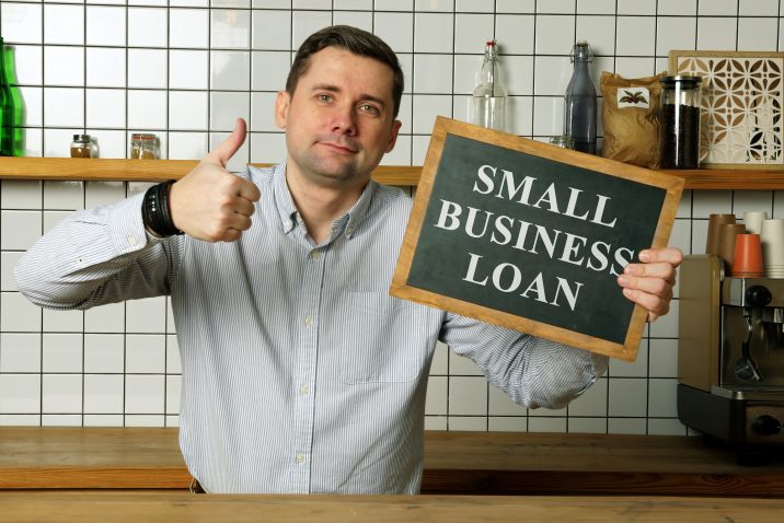 Small business loan in the businessman hands.