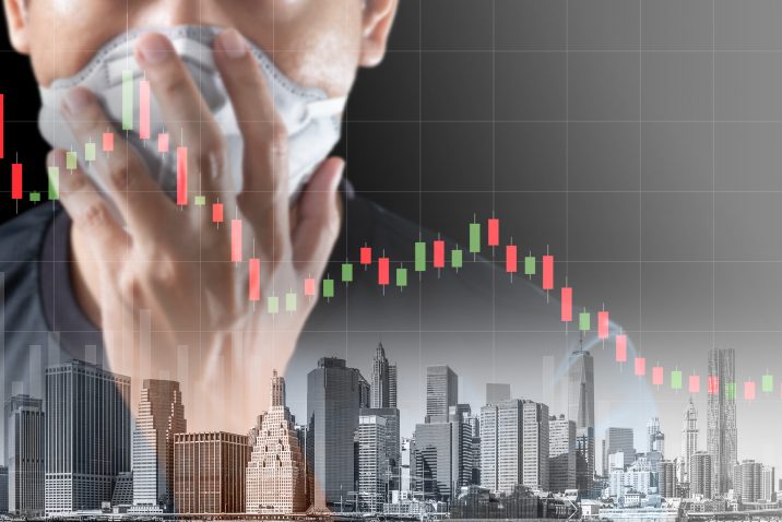 Concept of economic recession during the coronavirus crisis, downtrend stock and man with mask background