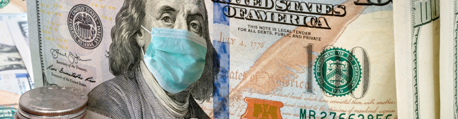 100 dollar money bills with medical face mask, COVID-19 coronavirus in USA.